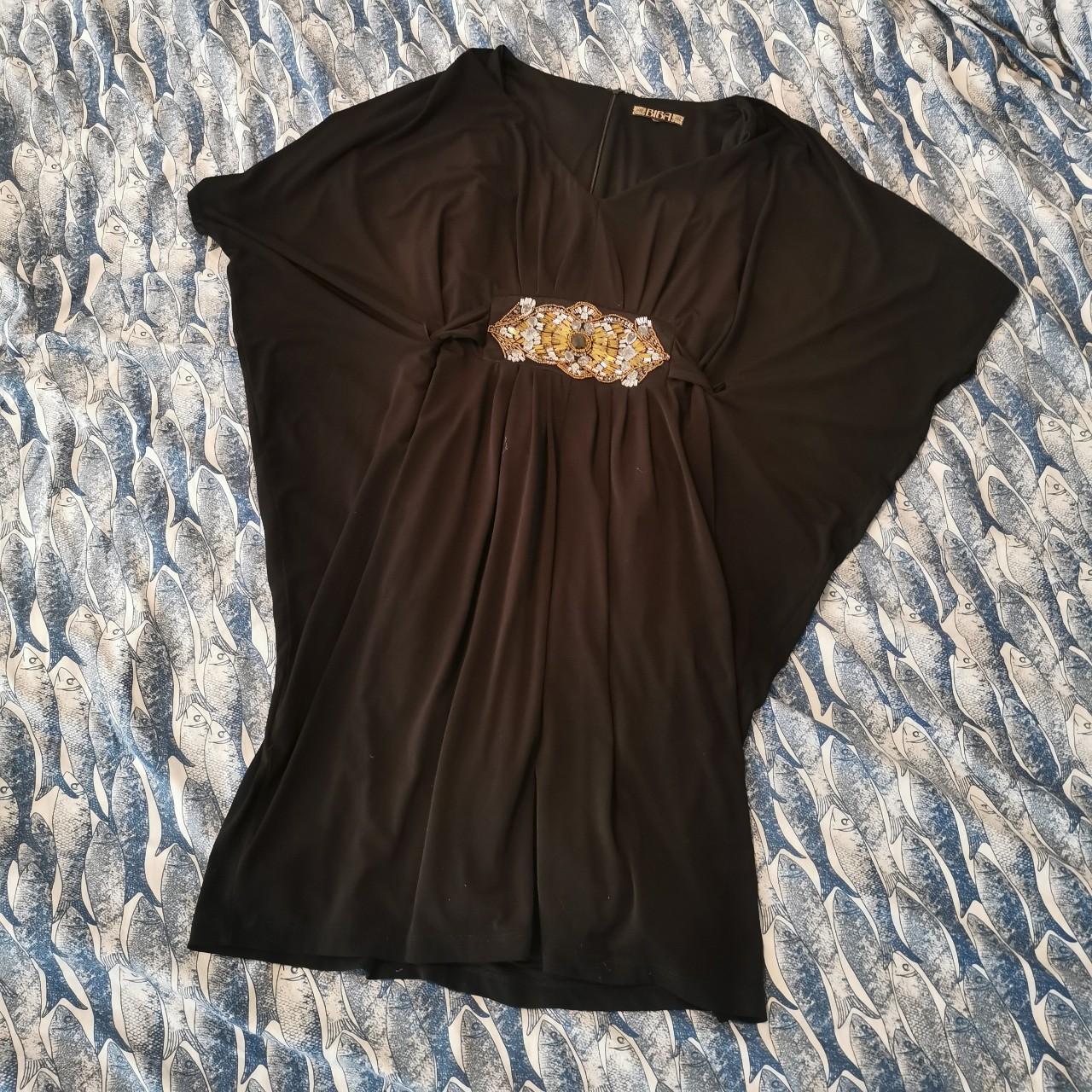 Black biba batwing dress, the belt feeds through the... Depop