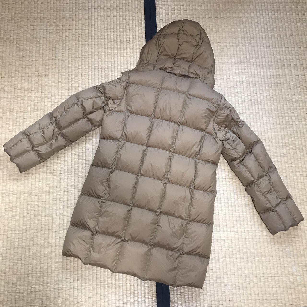 Uniqlo long quilted down puffer jacket in tan. Comes... - Depop