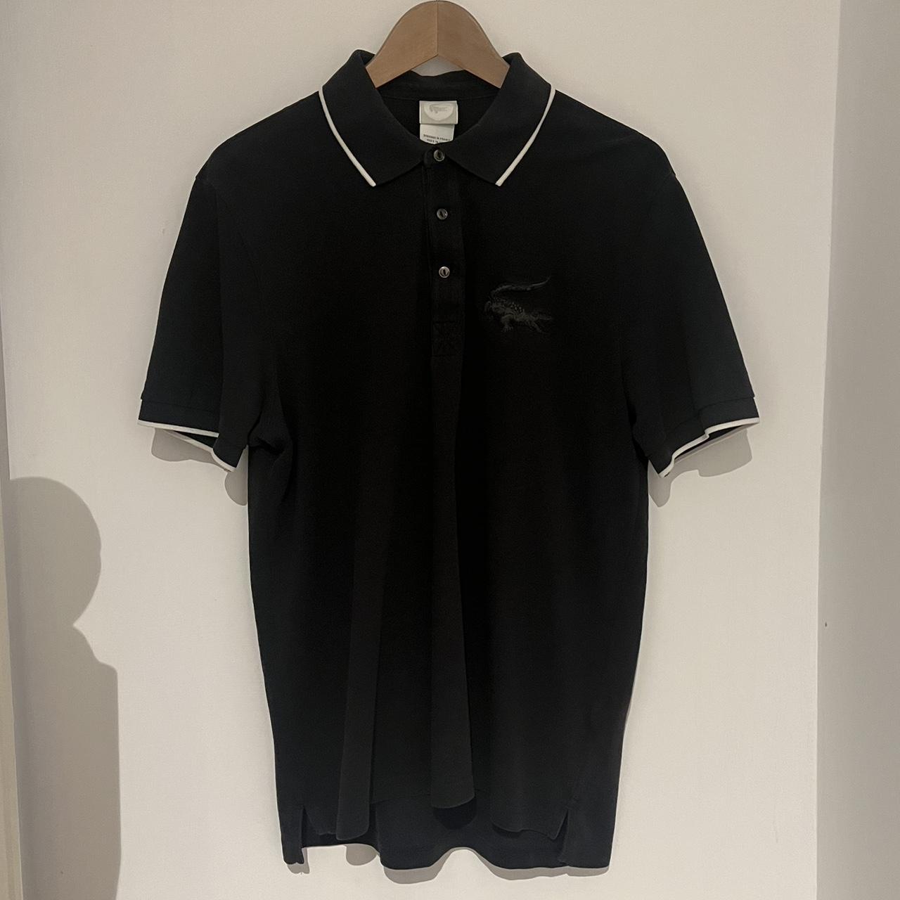 Lacoste polo black and white Fits a M/L Good... - Depop