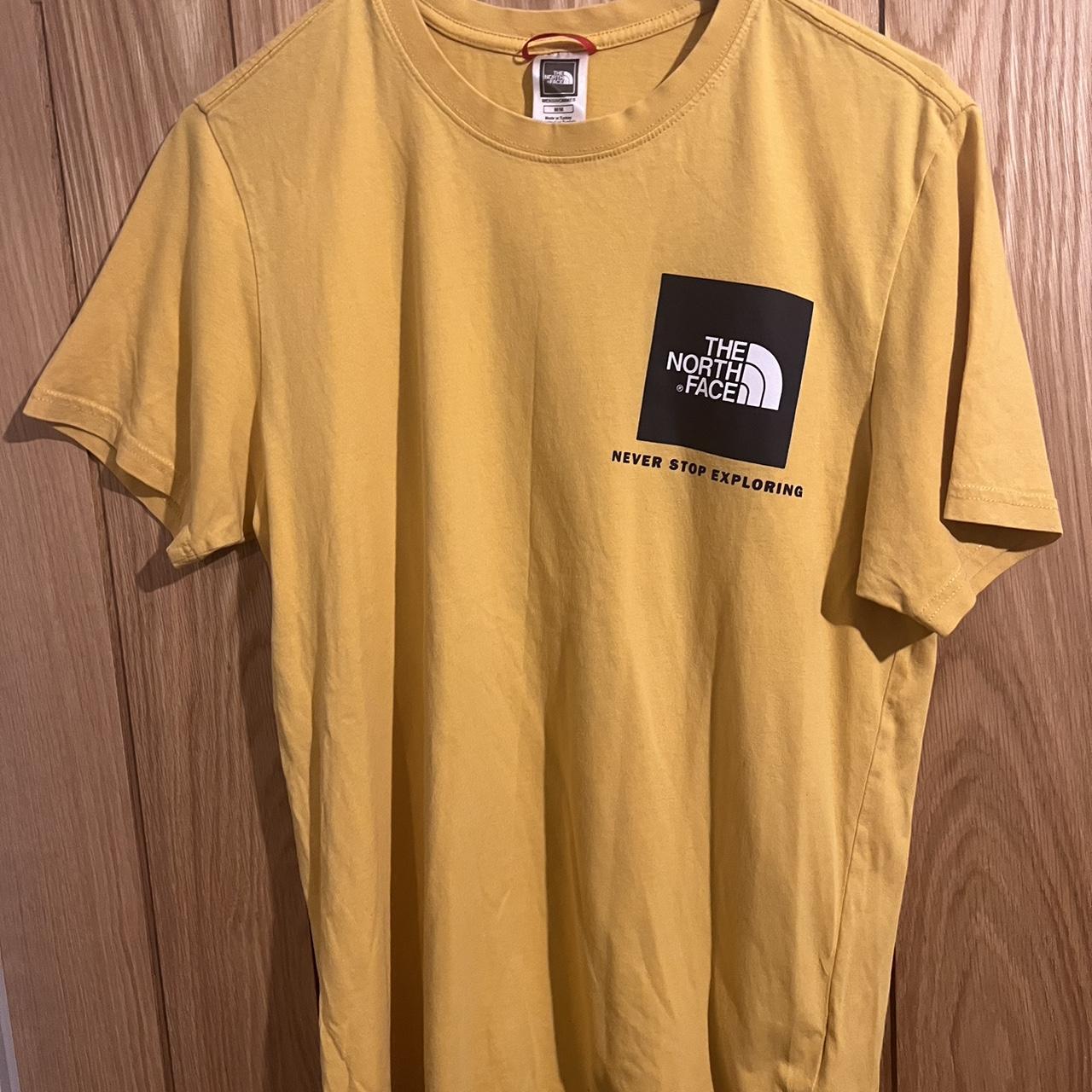 The north face yellow t with black logos Never... - Depop
