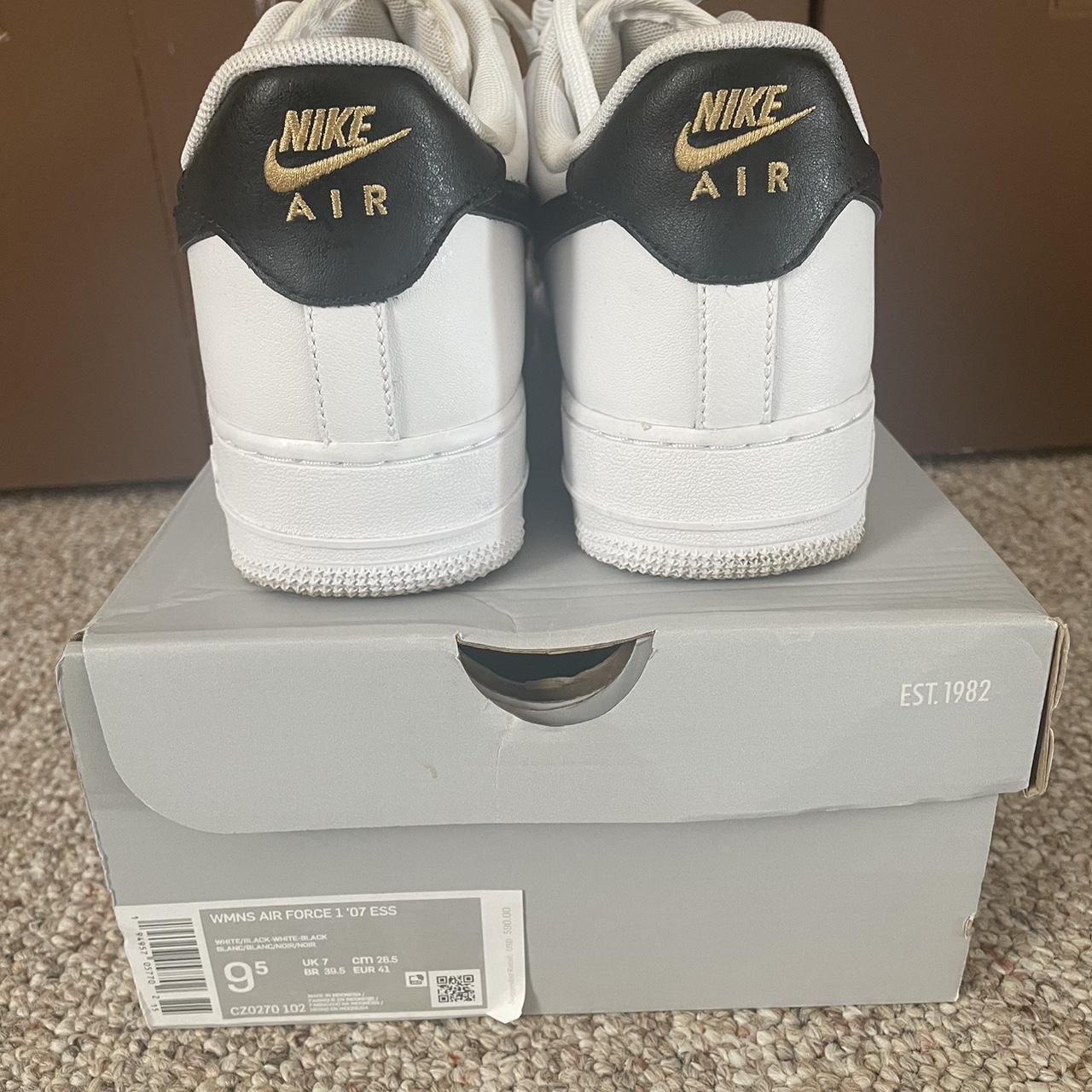 womens gold and black nike shoes