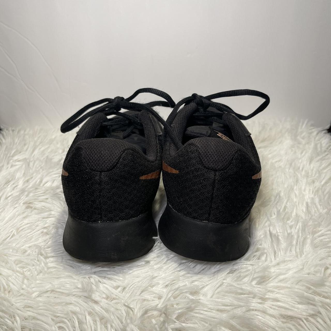 black nikes rose gold swoosh