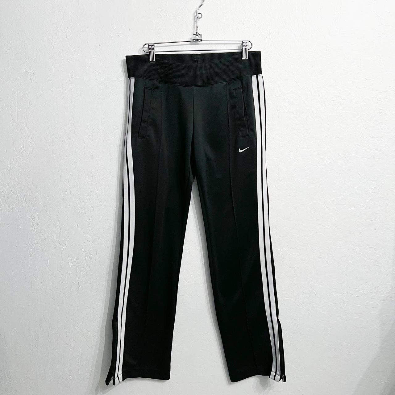 Black nike pants with white stripe fashion