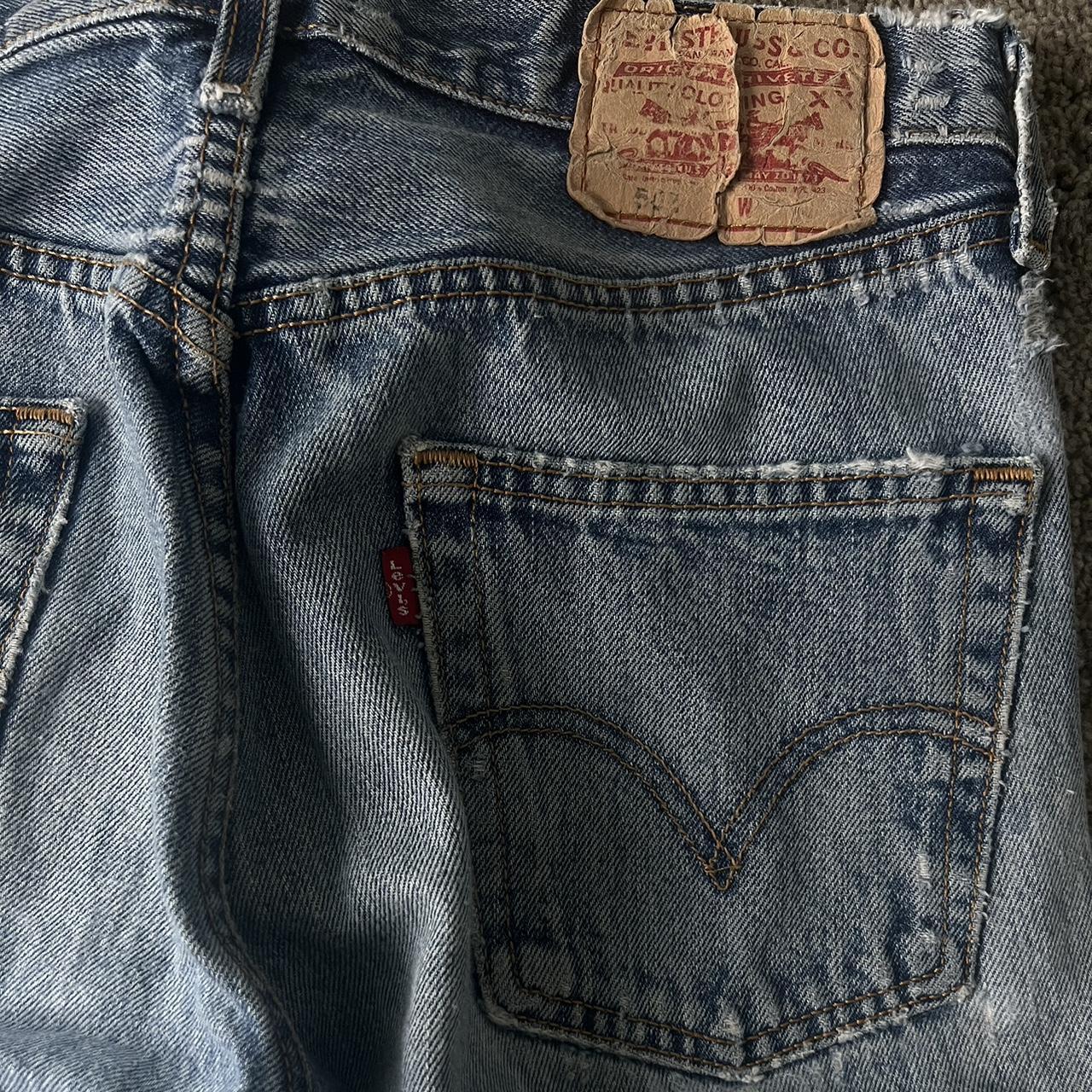 Vintage Levi blue ripped jeans Hole near the crotch... - Depop