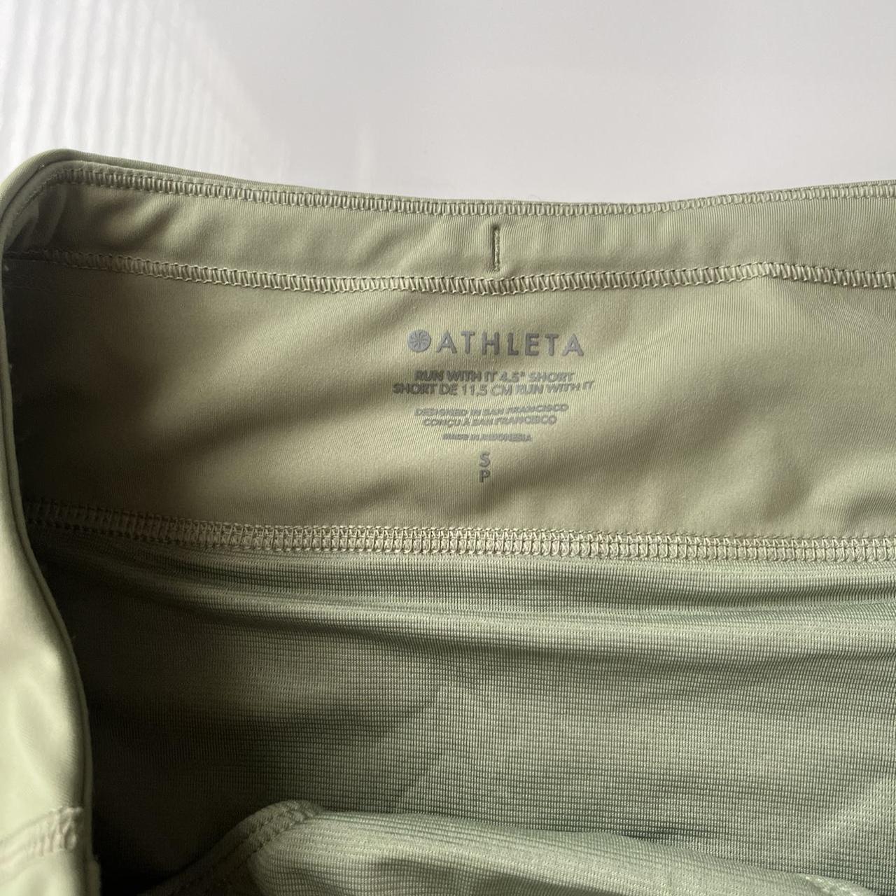 Athleta run with it 4.5” NWOT Athleta olive green... Depop
