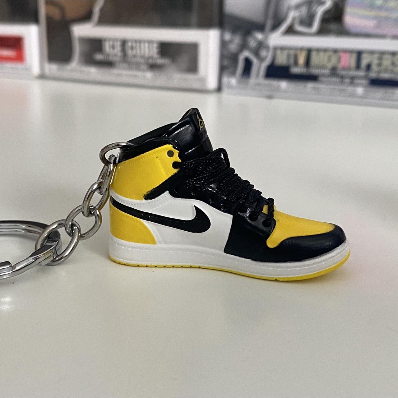 yellow nike keychain