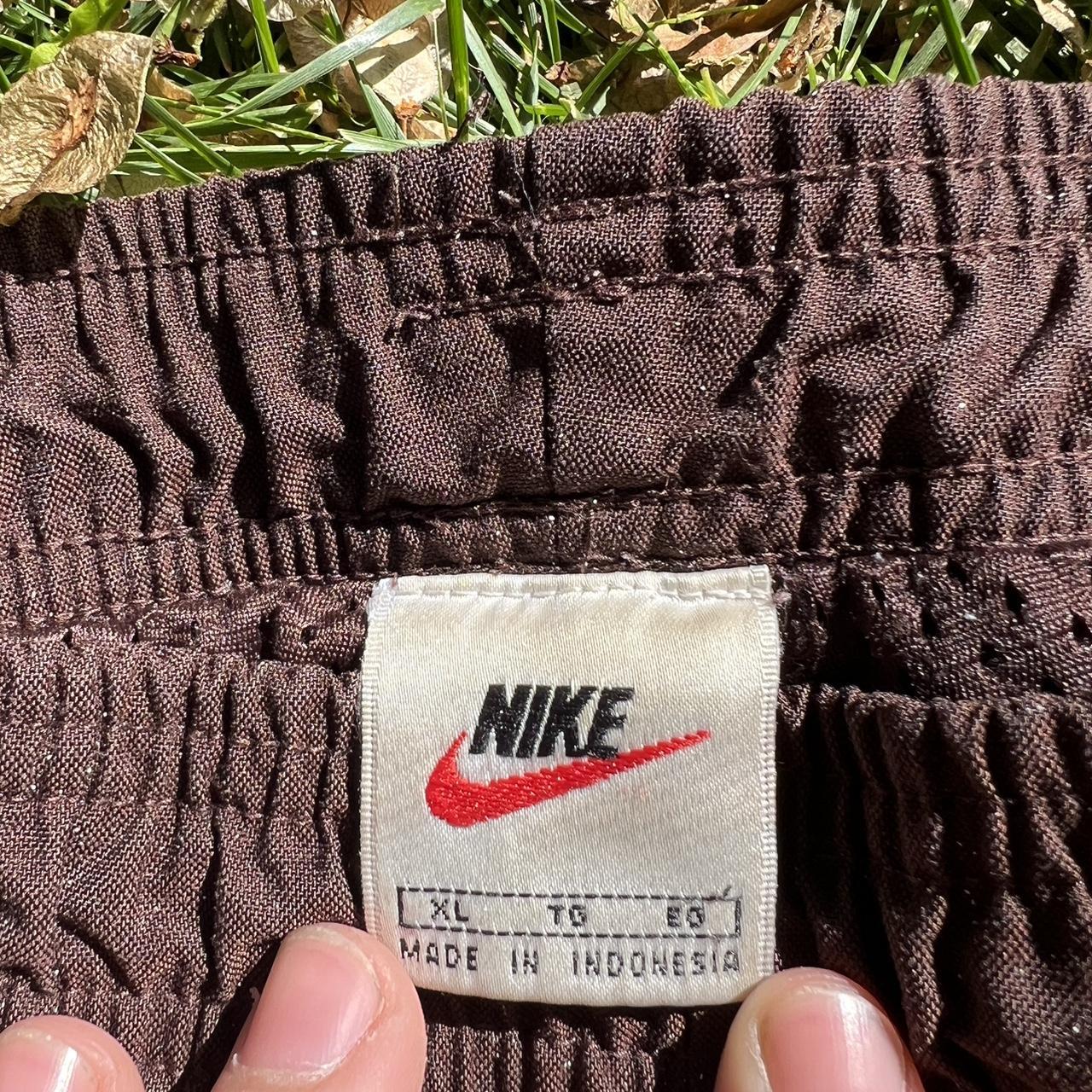 Vintage Nike heavyweight track pants. One small rip... - Depop