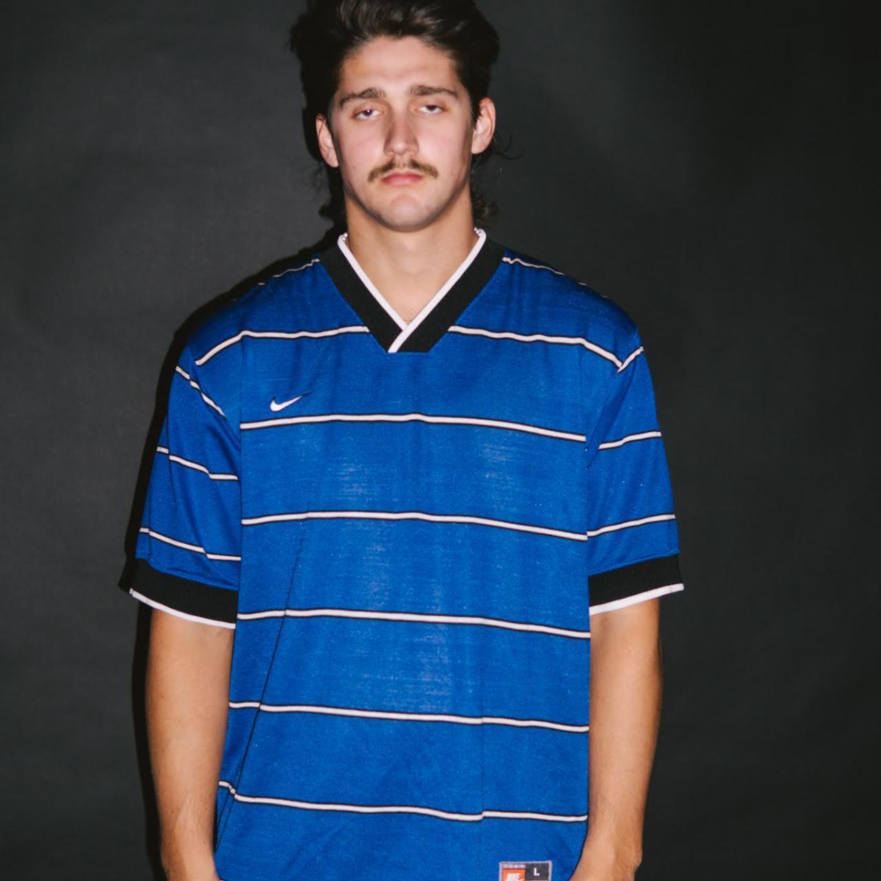 royal blue and orange nike shirt