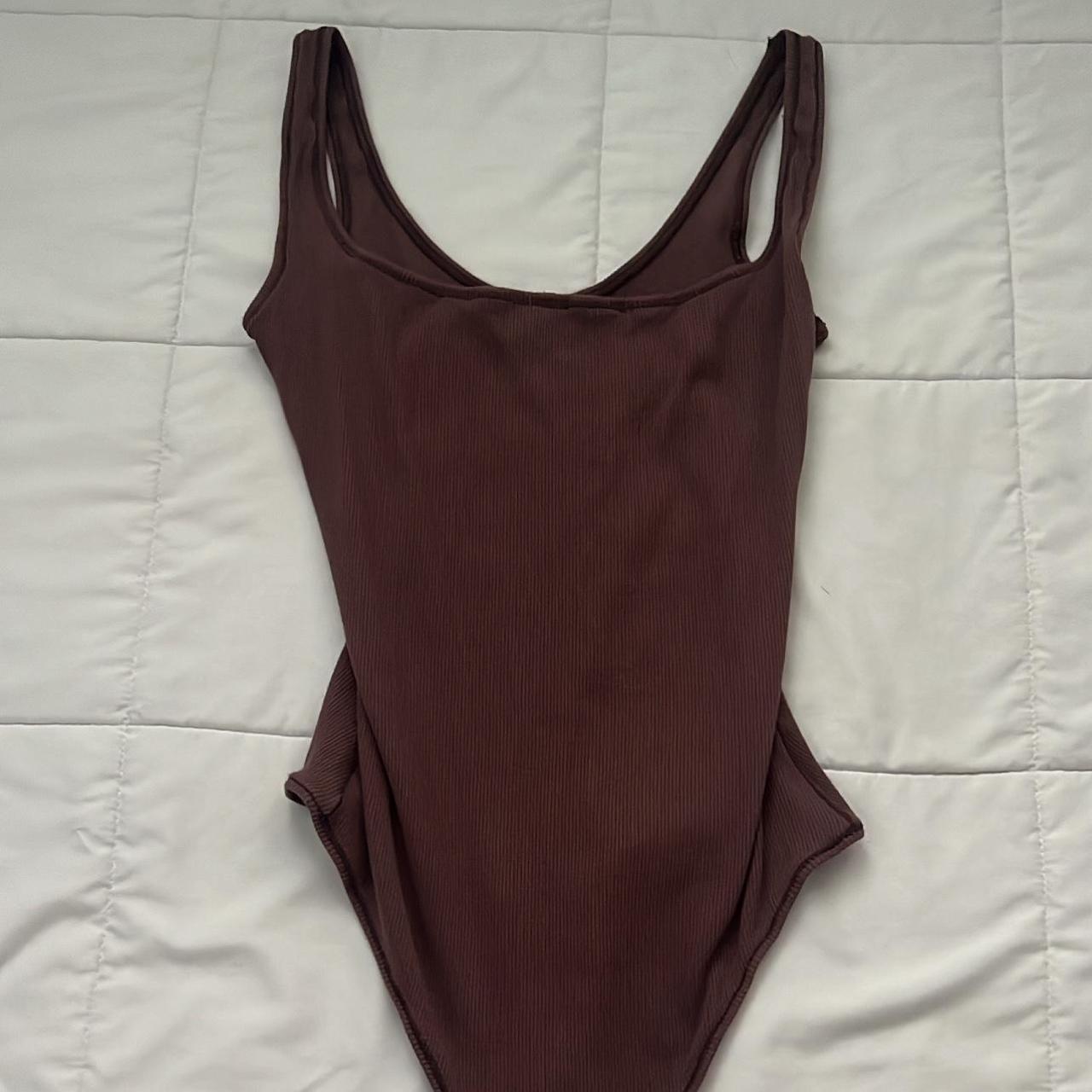 skims bodysuit 🤎 used small oil stain in the last... Depop