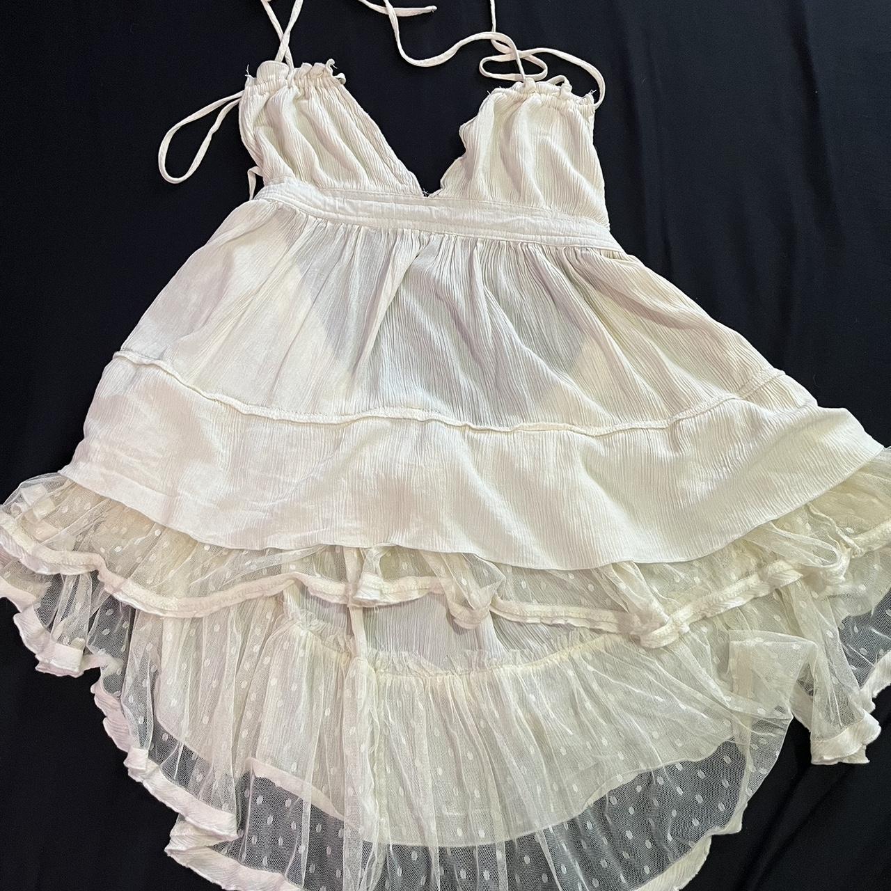 Cream flowy backless dress with lace trim Super... Depop