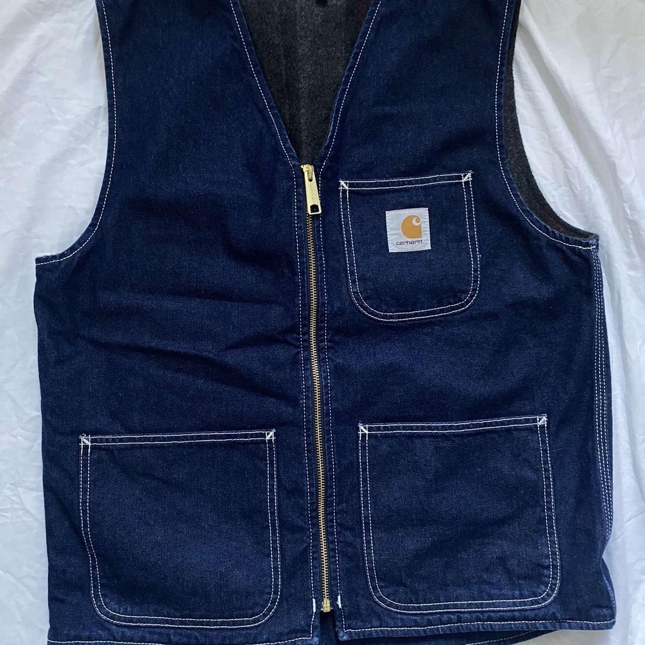 Carhartt navy denim vest with a zipper on the front Depop