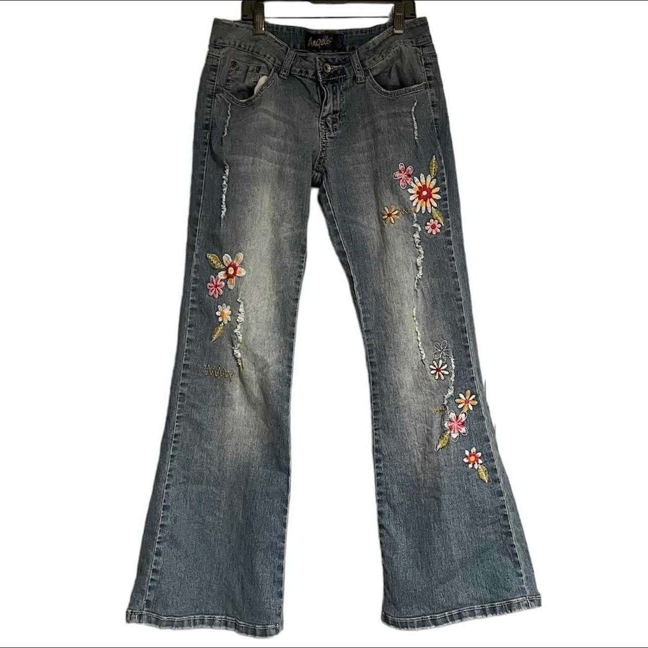 Low waisted flared jeans with embroidered flowers.... - Depop