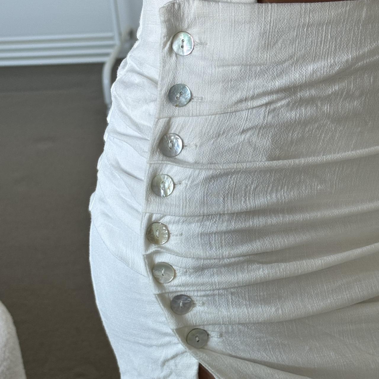 cutest white skirt pearly button detailing on the... - Depop