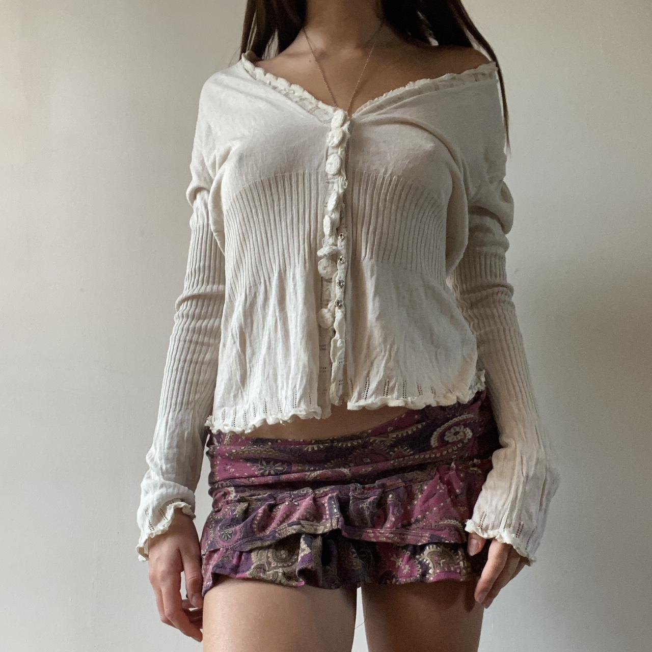 Cream and white knit cardigan with ruffle trim and... - Depop