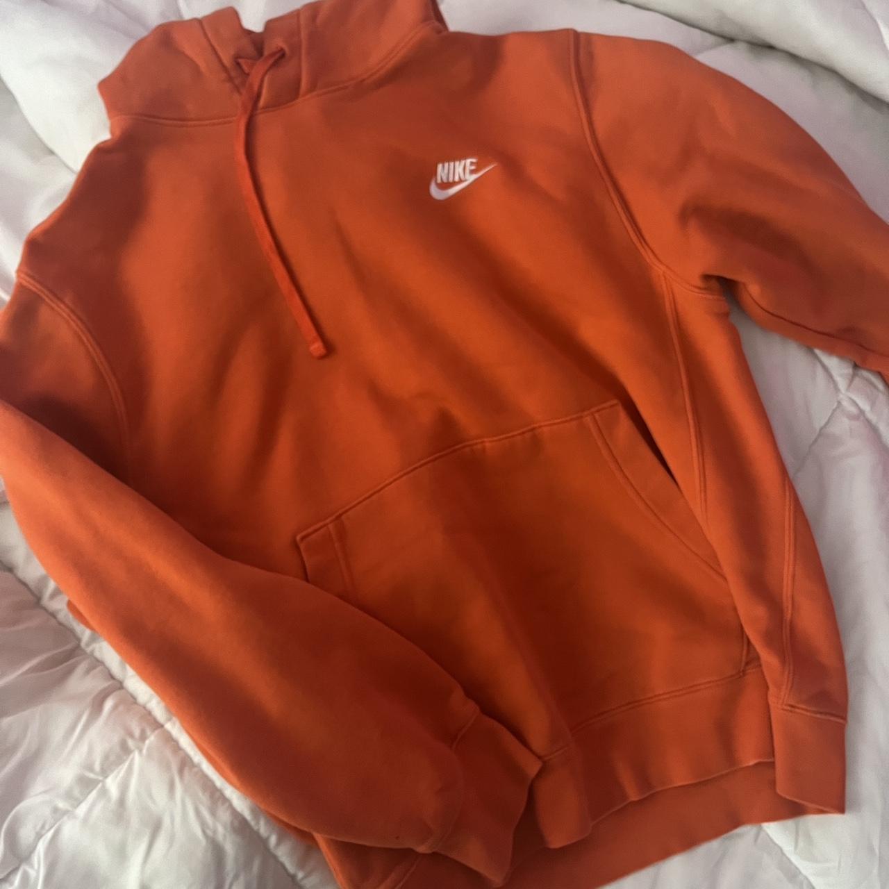 white nike hoodie with orange logo