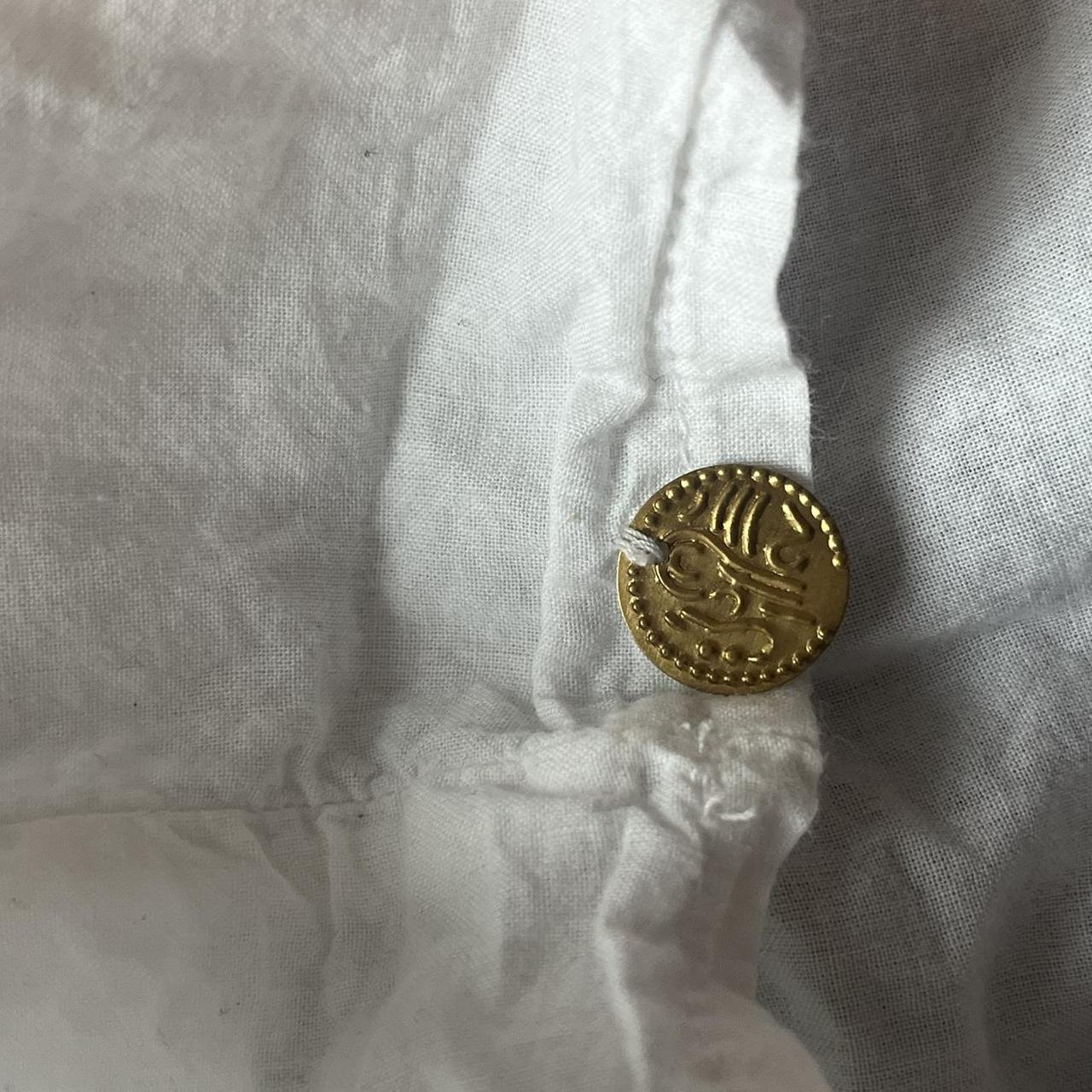 white maxi skirt with gold medallions along hem,... - Depop