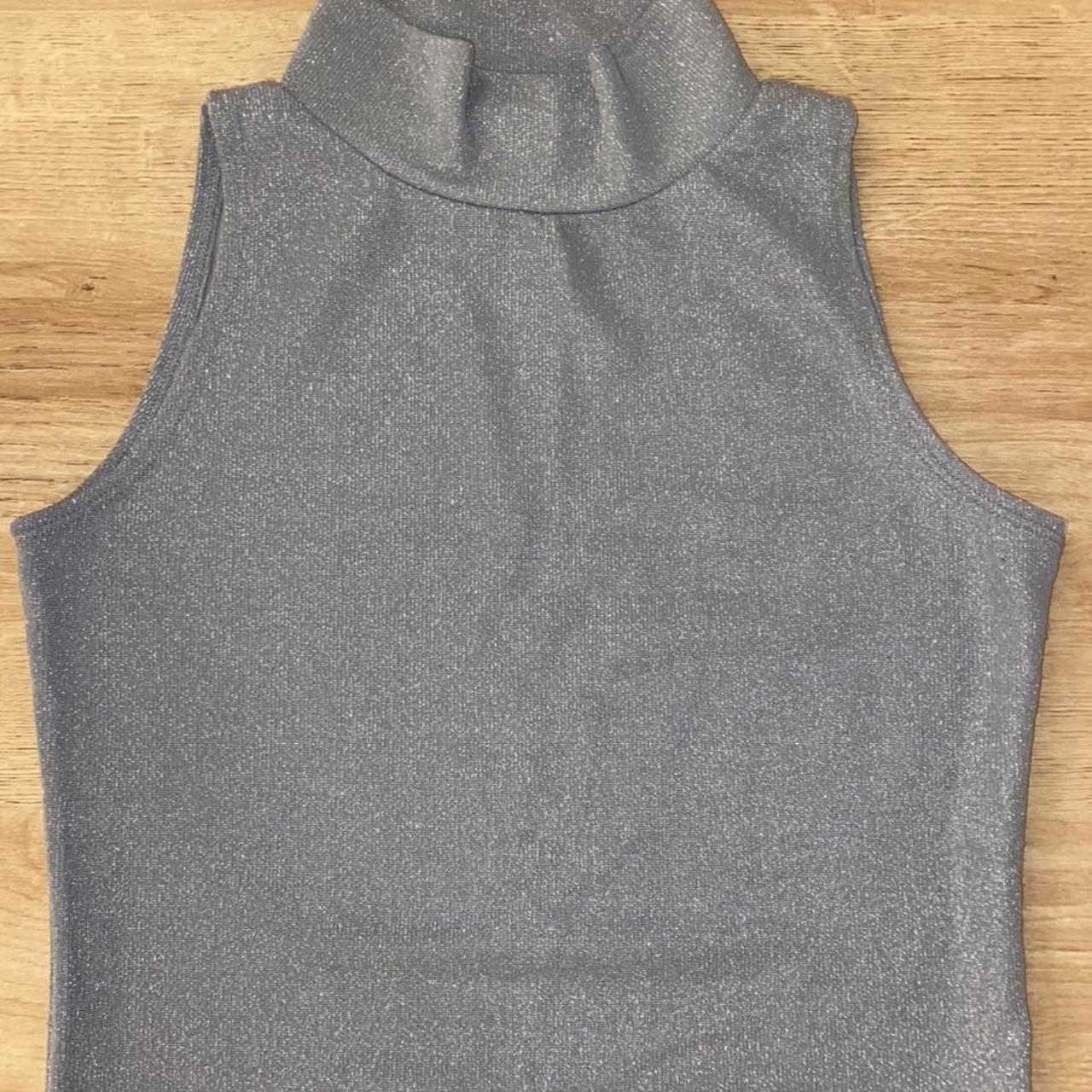 SILVERISH BLUE SLEEVELESS TURTLENECK CROP TOP worn... - Depop