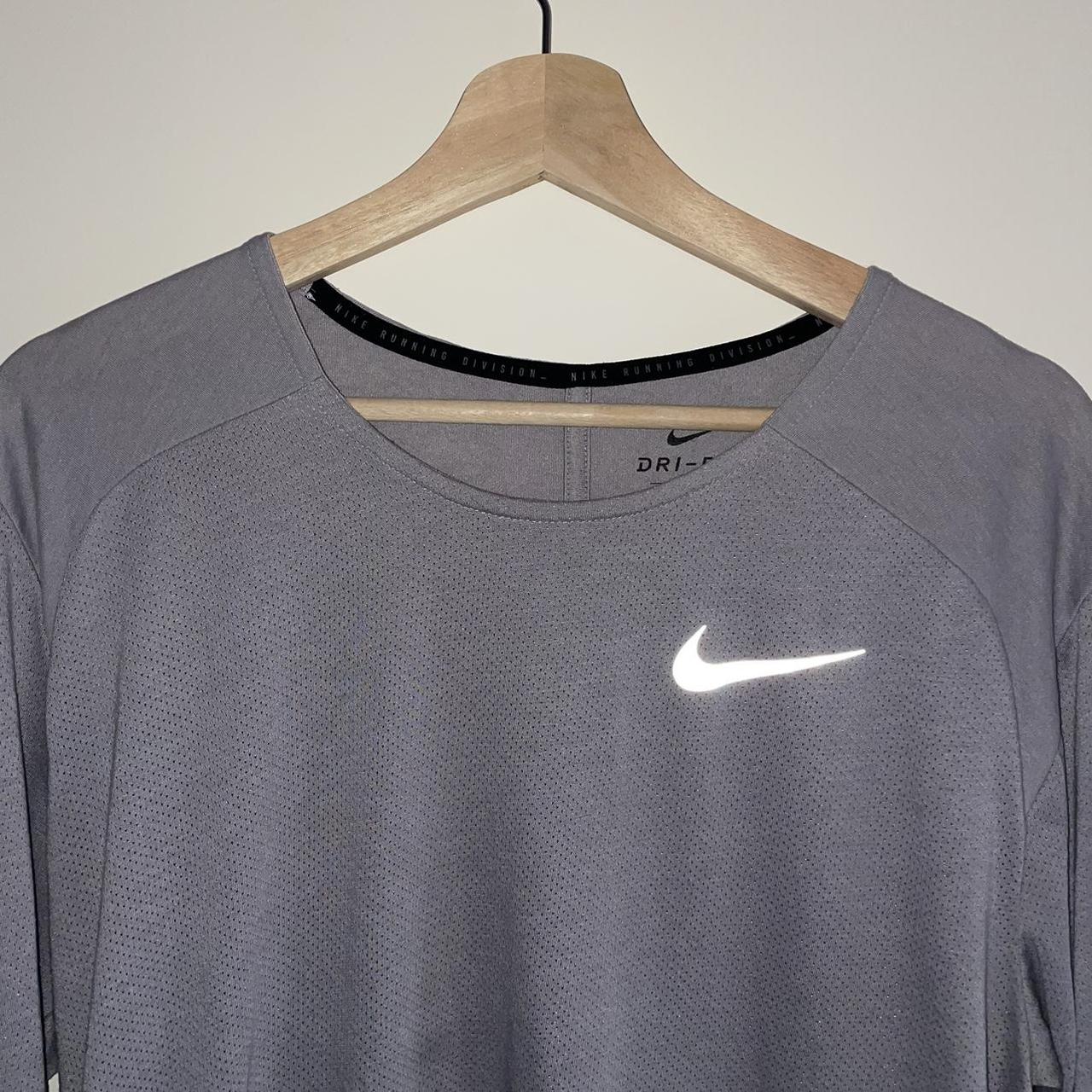 Nike Dri-FIT running top. Half-sleeves with... - Depop