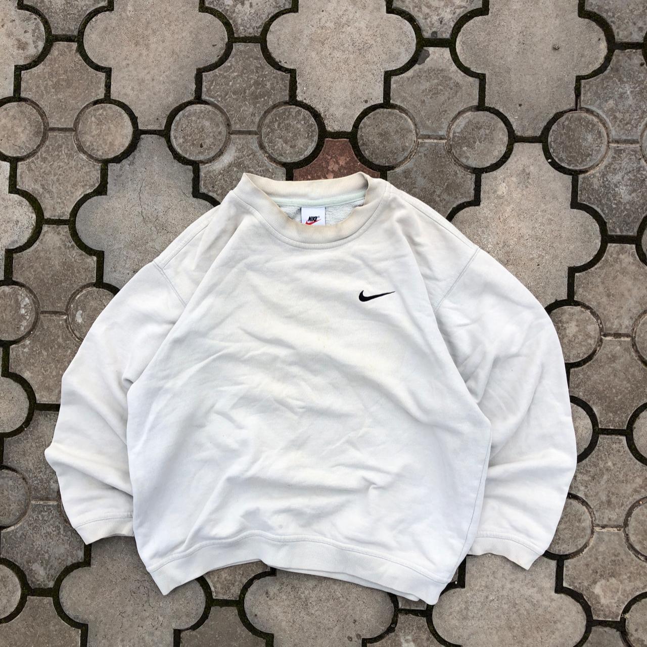 cream and black nike