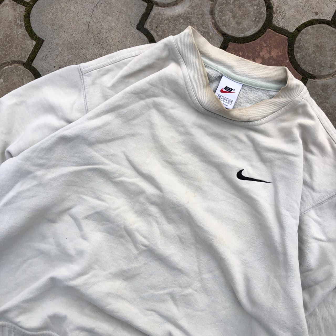 cream and black nike