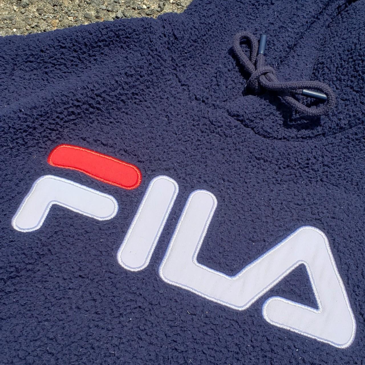 Small FILA Hoodie in good condition with sight pilling. - Depop