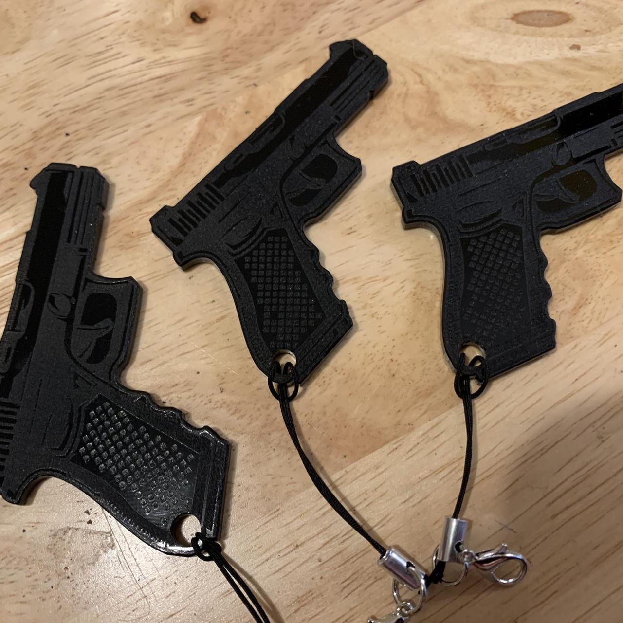 I have these handmade acrylic Glock keychains.... Depop