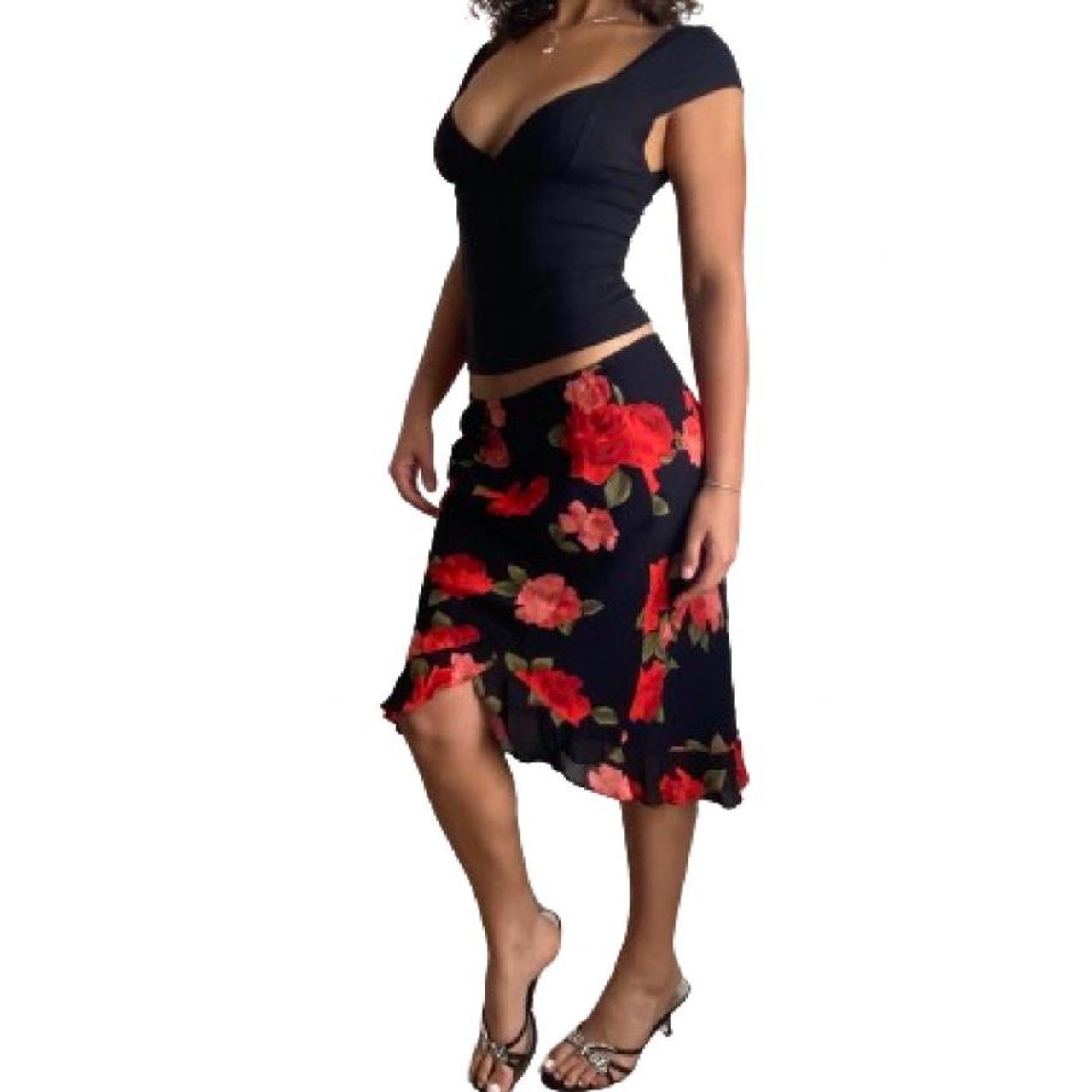 Red and black fitted floral skirt with a fluted... - Depop