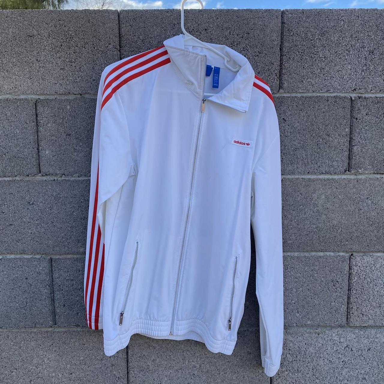 red track jacket with white stripes