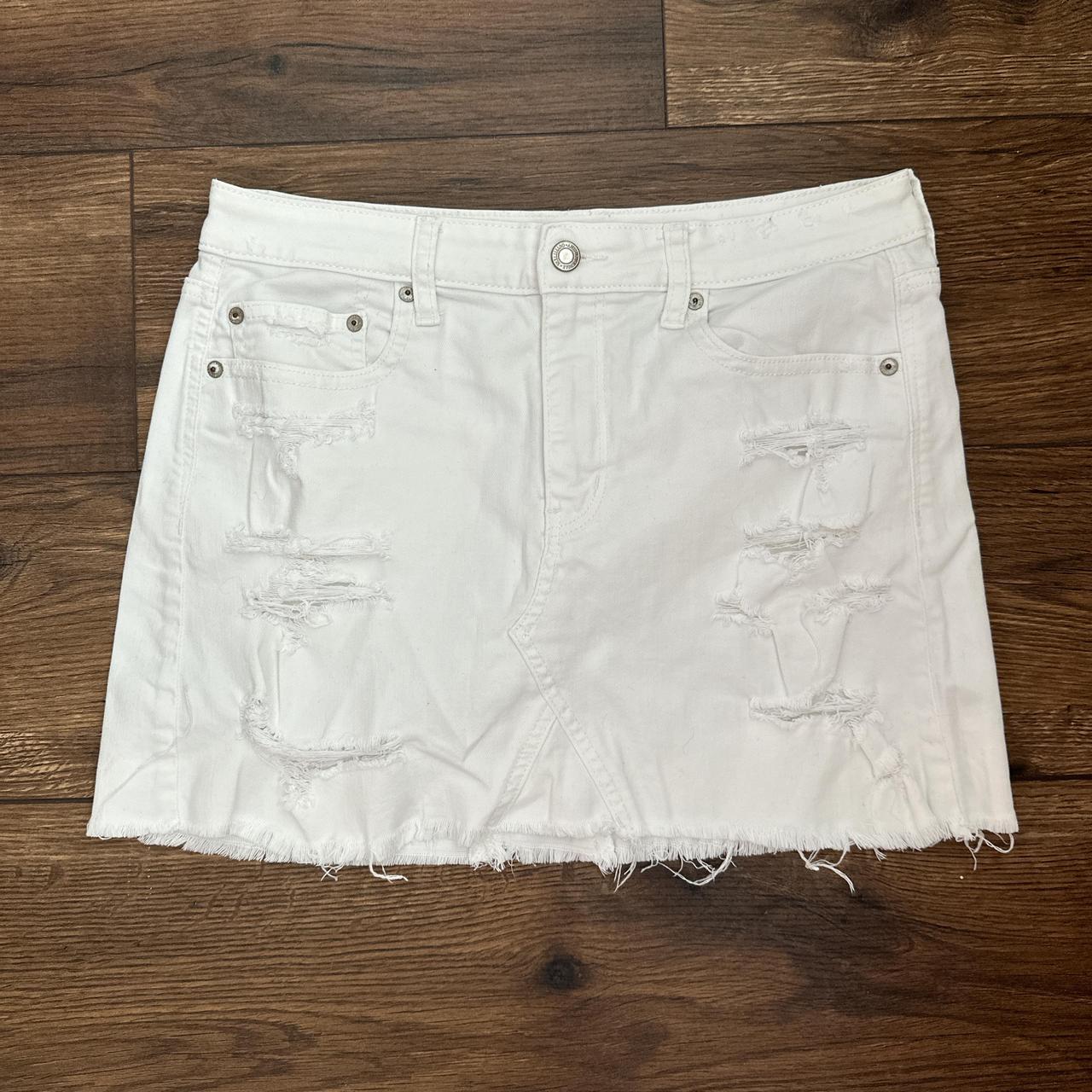 White distressed American Eagle denim skirt. Length