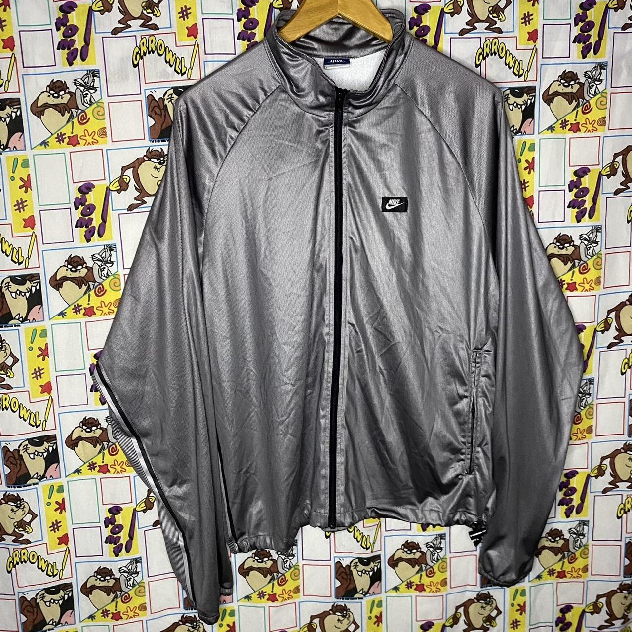 Black and silver nike jacket best sale