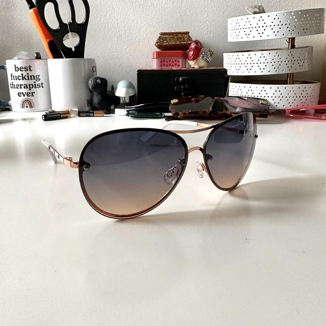 white and rose gold Tahari sunglasses has a. Depop