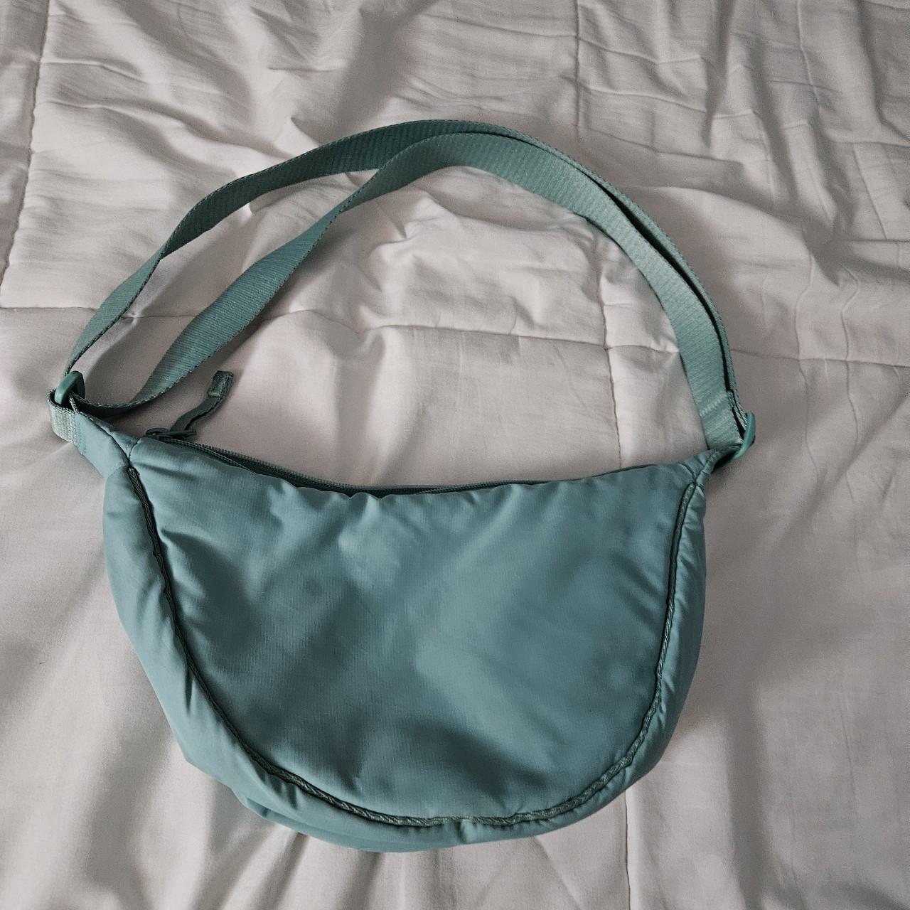 Uniqlo mini round shoulder bag in the blue color! I... - Depop