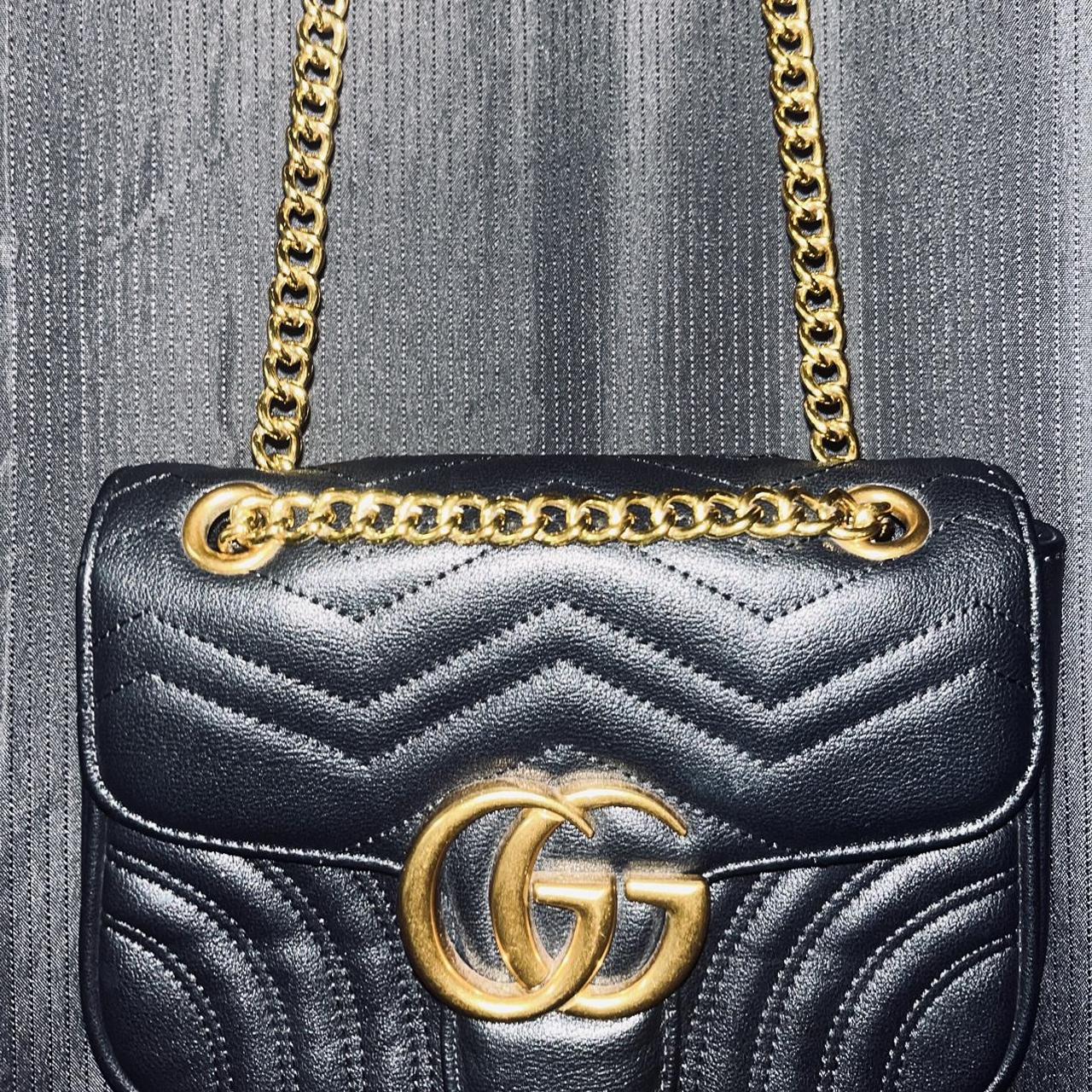 Gucci Women's Black and Gold Bag Depop