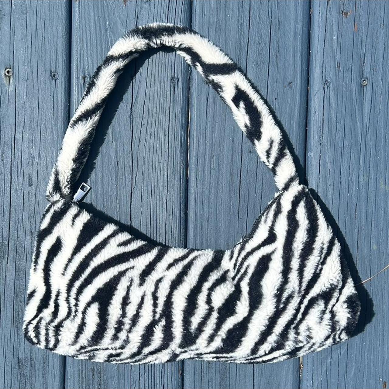 FURRY ZEBRA PURSE so cute. The lining inside is Depop