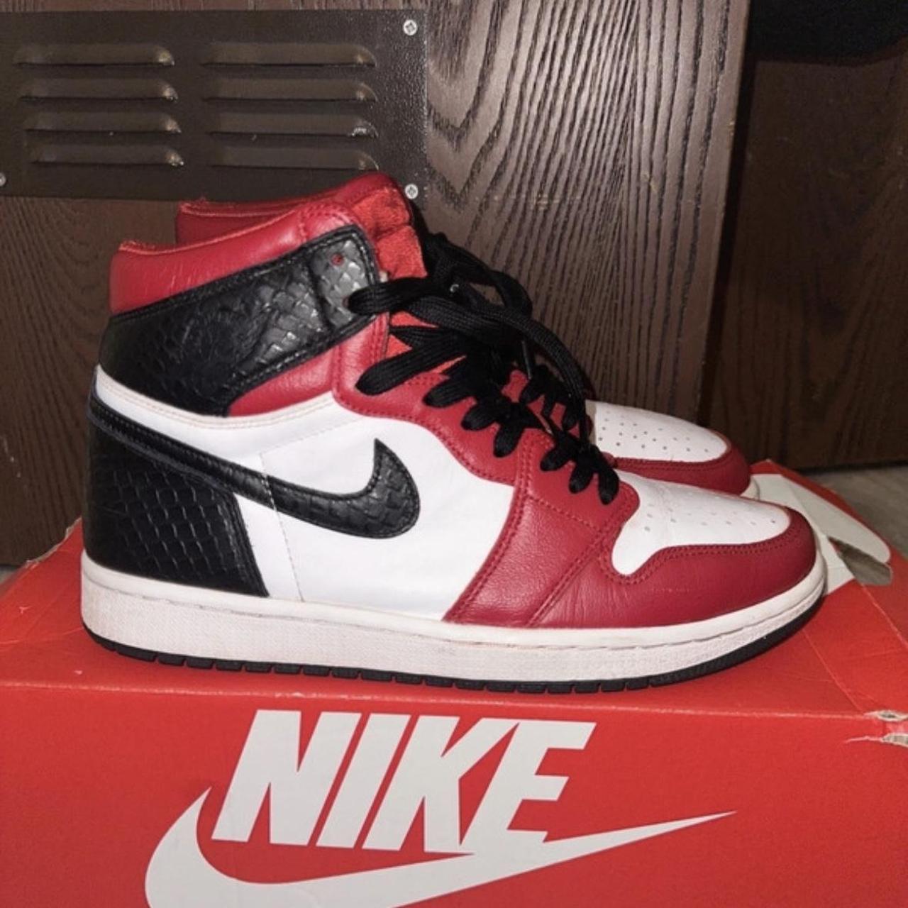 half black half red jordan ones