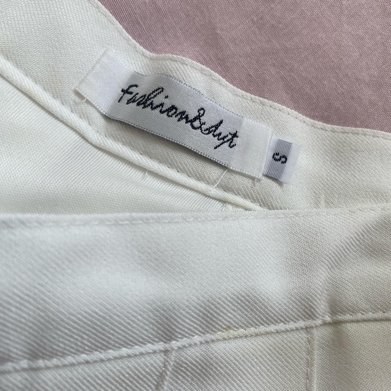 white pleated mini skirt size small with shorts on... - Depop