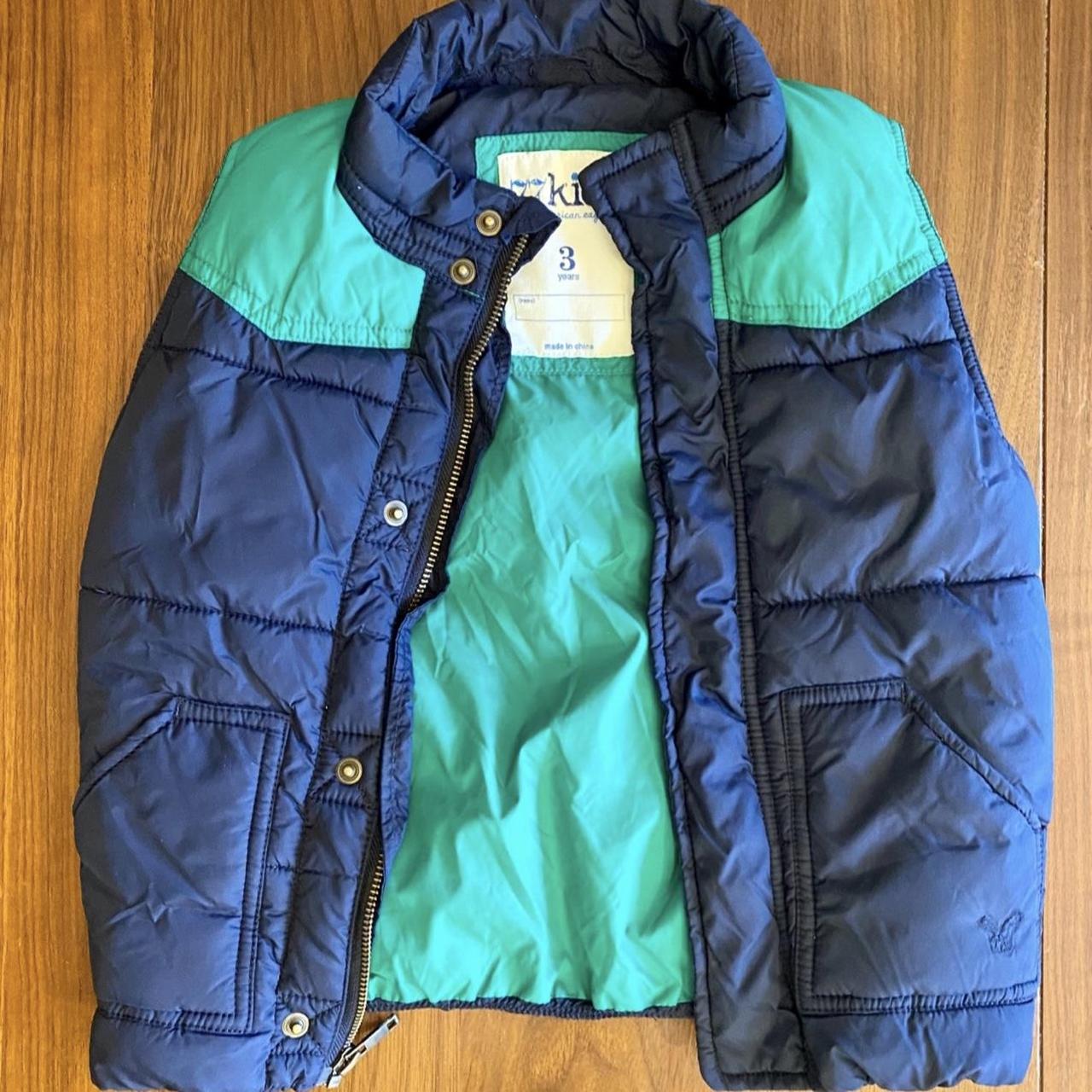 Child’s navy blue and green two toned puffer... - Depop