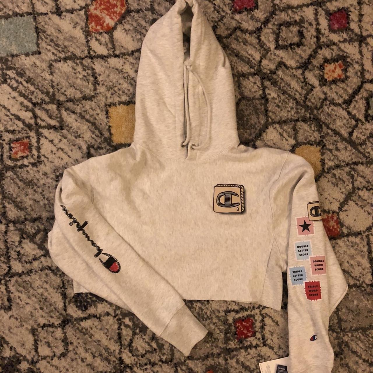 White champion hoodie with colored online letter