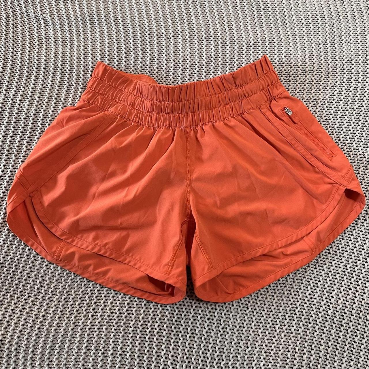 4” lululemon neon orange hotty hot shorts