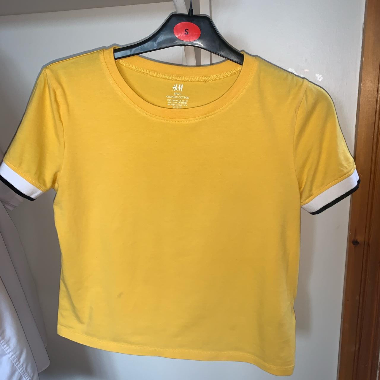 H&M yellow shirt with white and black sleeves. sized... Depop