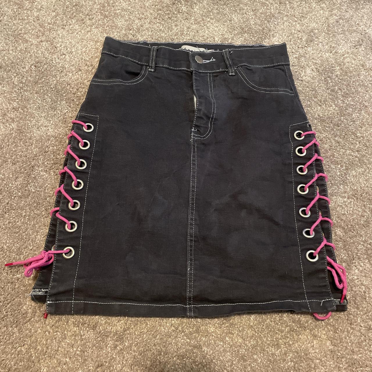 Black and pink lace up mini skirt with a zip up the... Depop