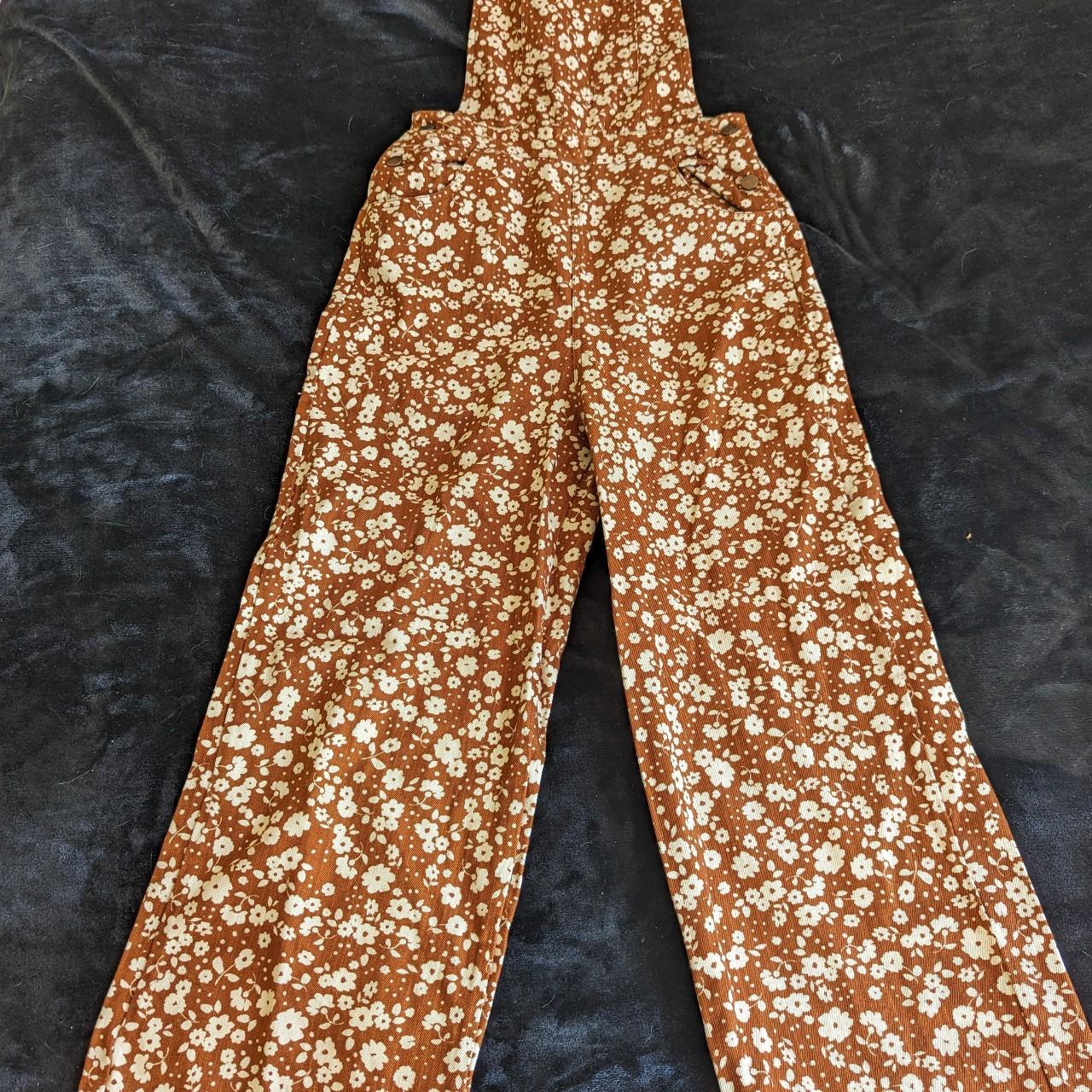 Orangey/tan and white floral print overalls from... - Depop