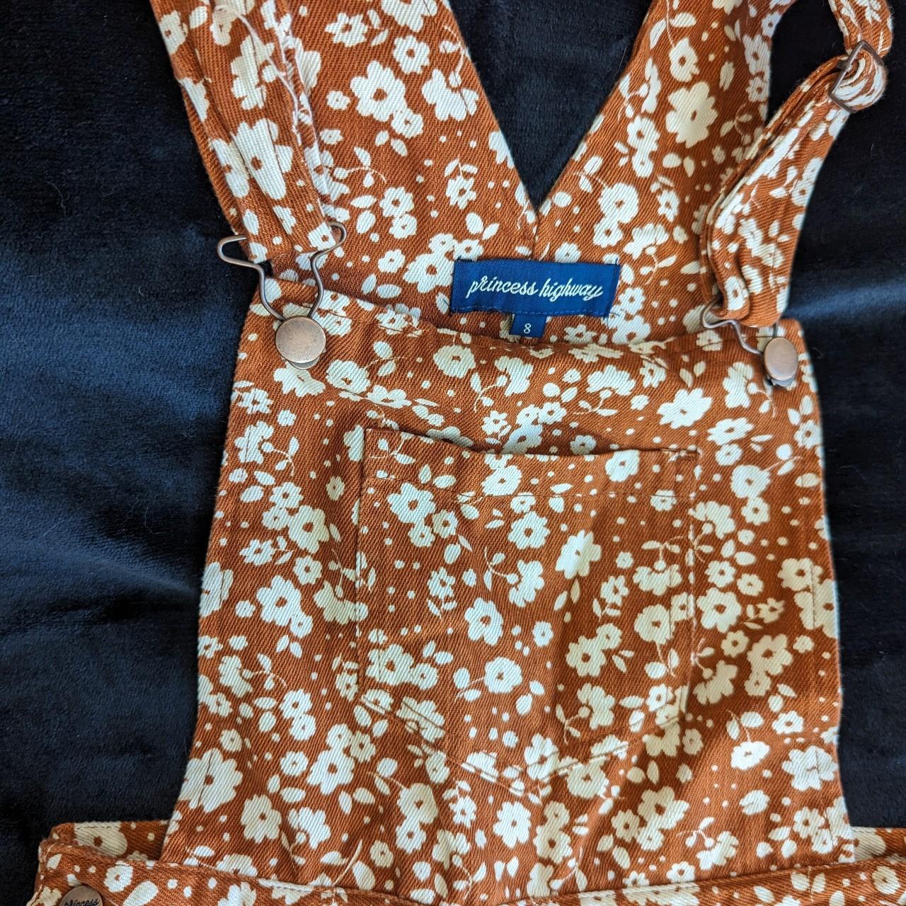 Orangey/tan and white floral print overalls from... - Depop