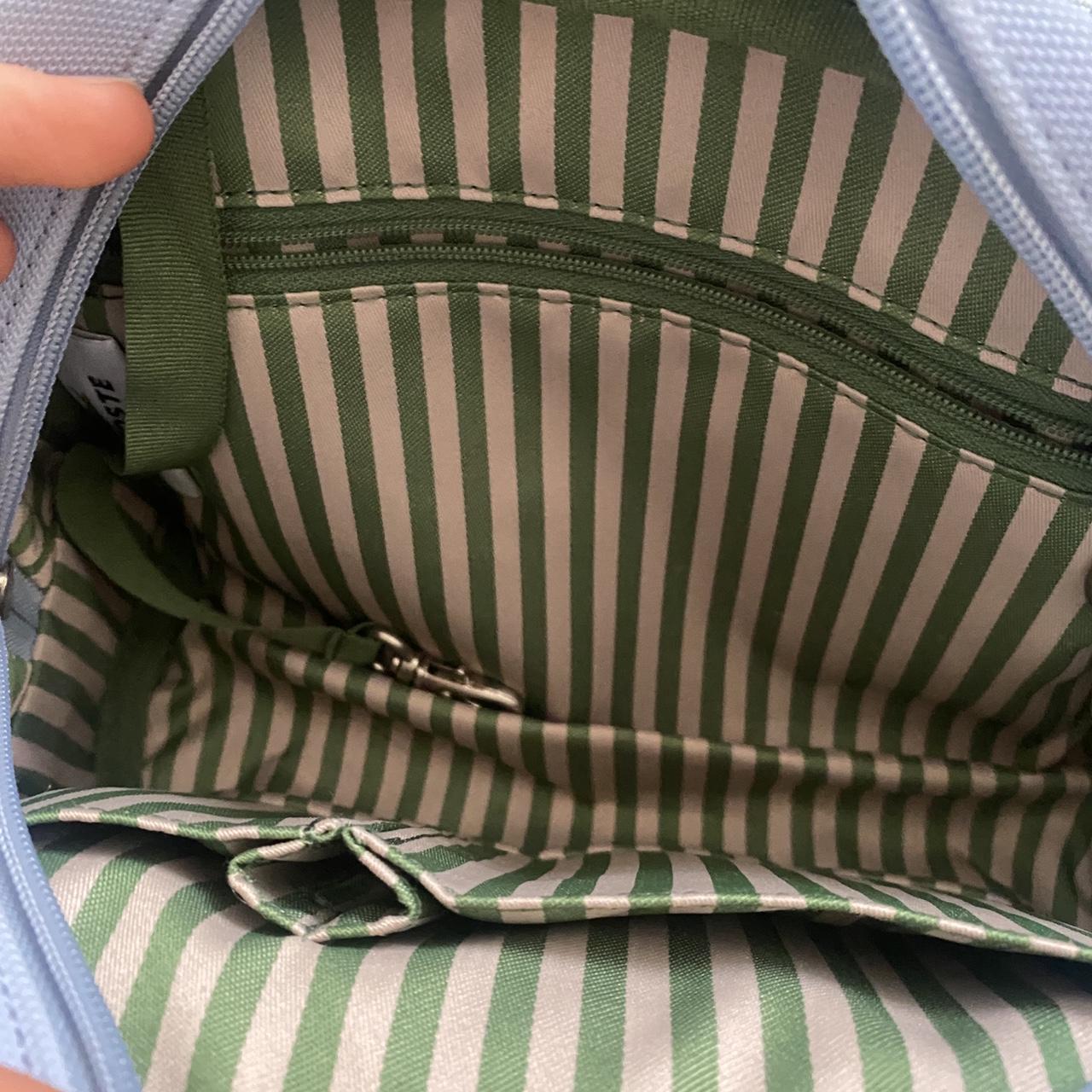 Lacoste light blue hand bag with striped interiors. - Depop