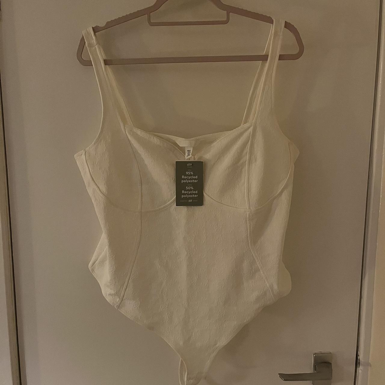 White bodysuit with subtle flower pattern New with... Depop