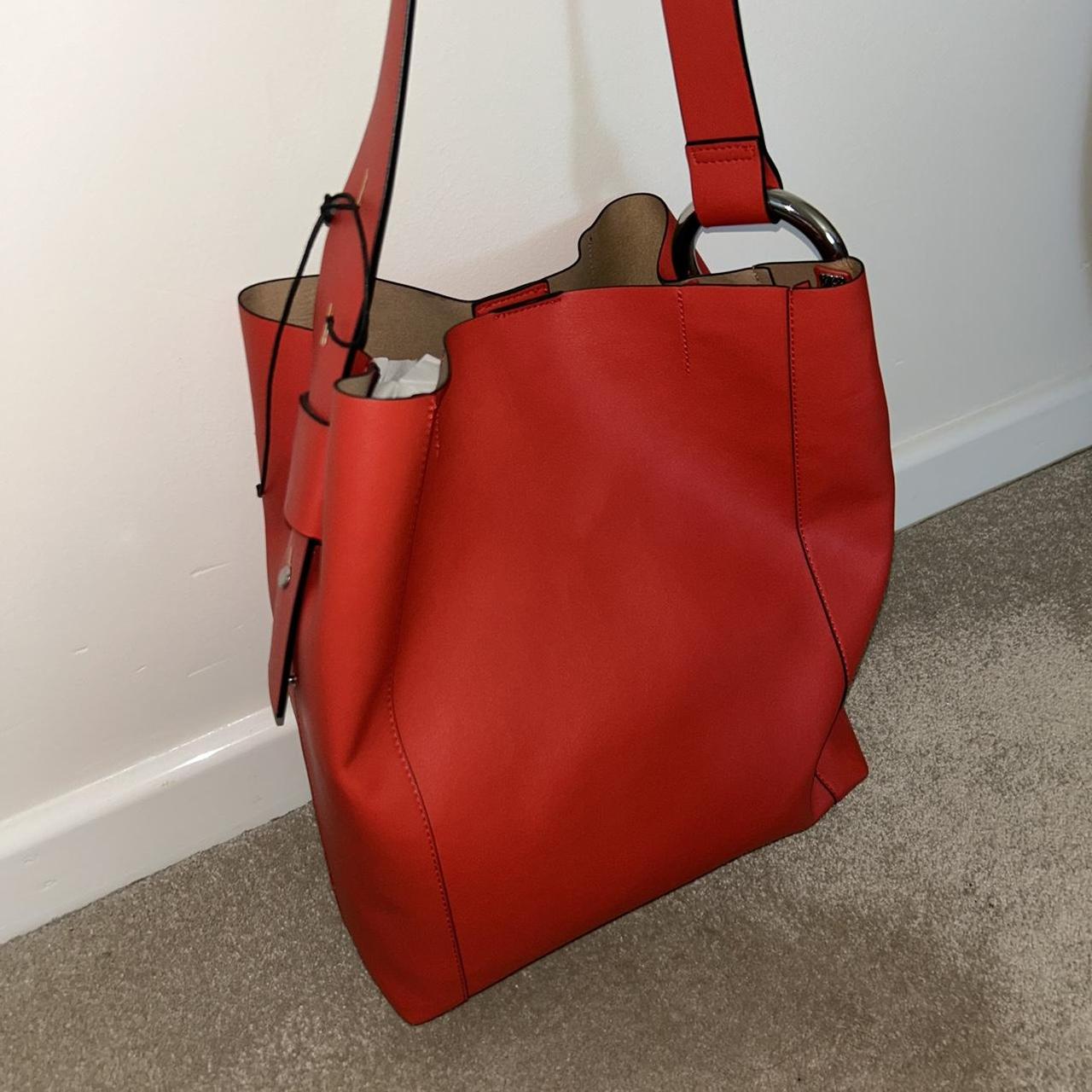 Red bucket bag with silver handle detailing Really... - Depop