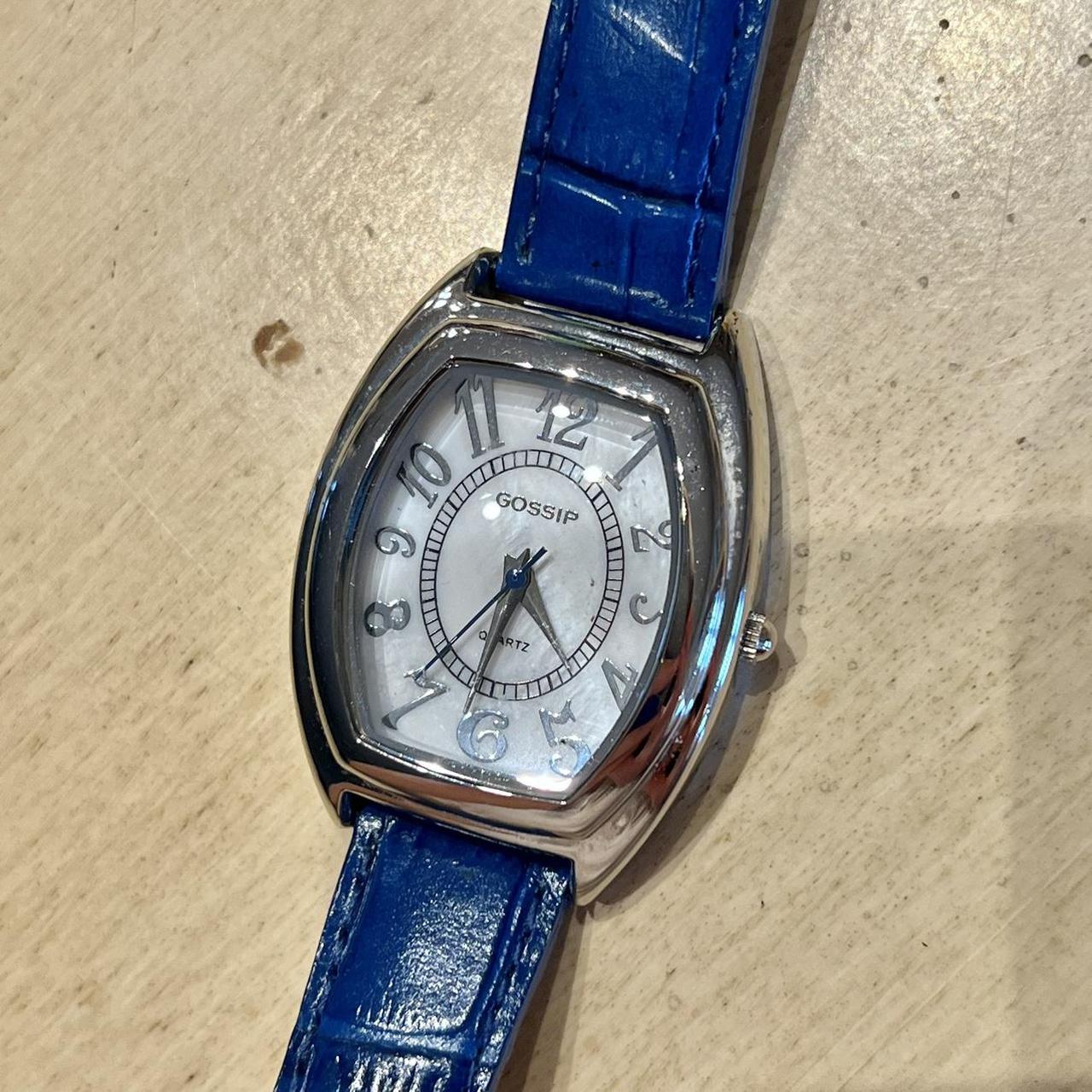 Watch with a blue leather adjustable strap. The face... - Depop