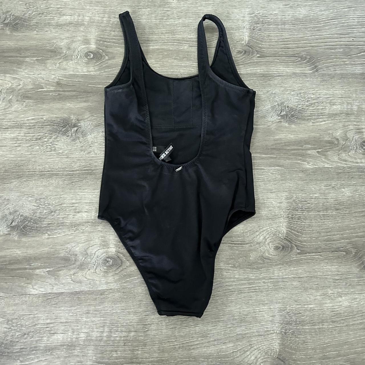 basic black one piece swimsuit with low cut back Depop