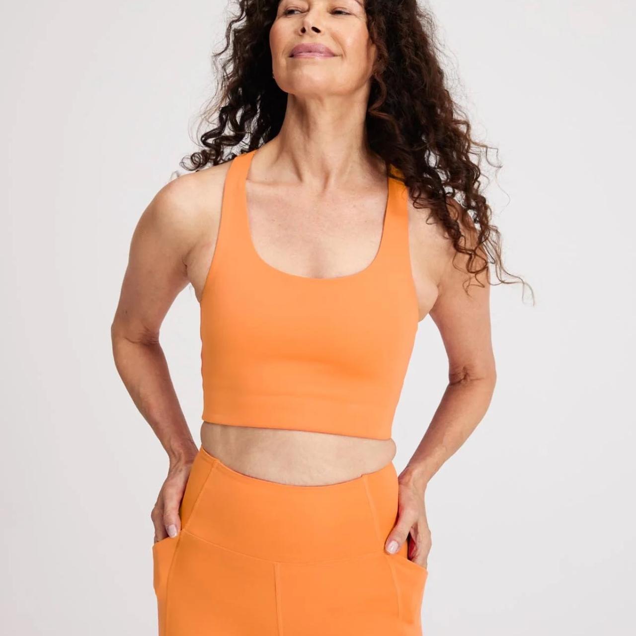 Girlfriend Collective orange workout set with... Depop