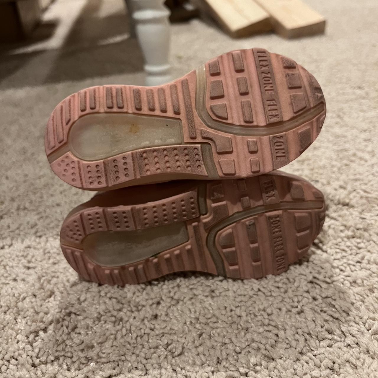 Pink kids tennis shoes, no laces strap up. They... Depop